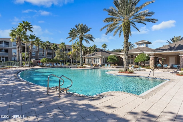 view of swimming pool with a patio