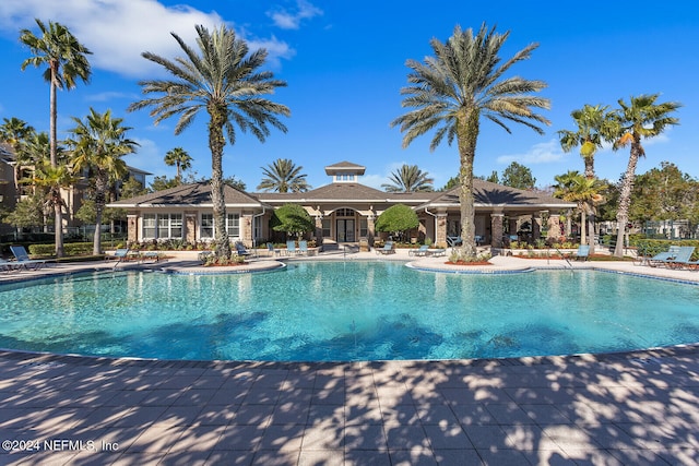 view of swimming pool featuring a patio area