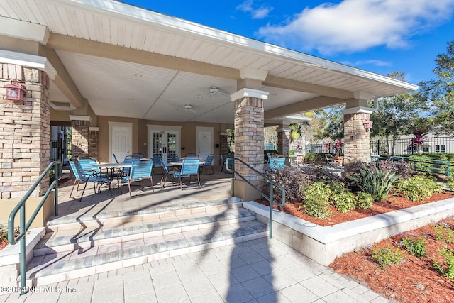 view of patio featuring ceiling fan and french doors