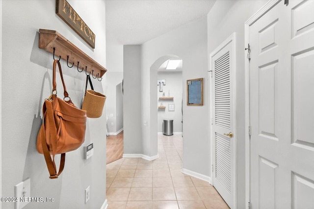 mudroom featuring light tile patterned floors