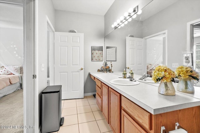 bathroom with tile patterned floors and vanity