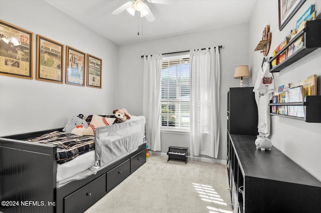 carpeted bedroom featuring ceiling fan