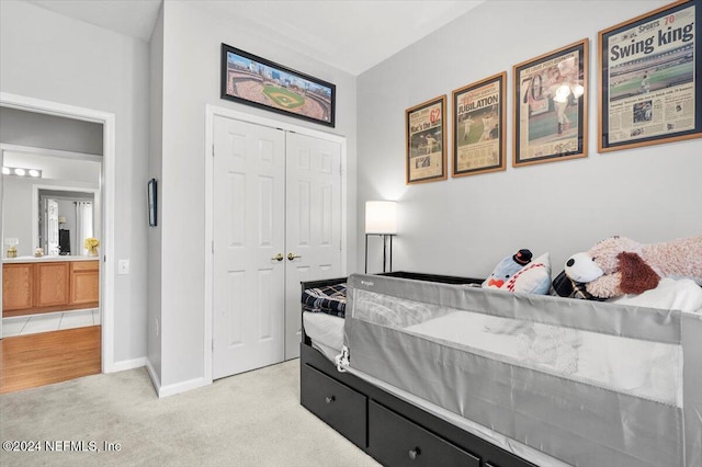 carpeted bedroom with a closet