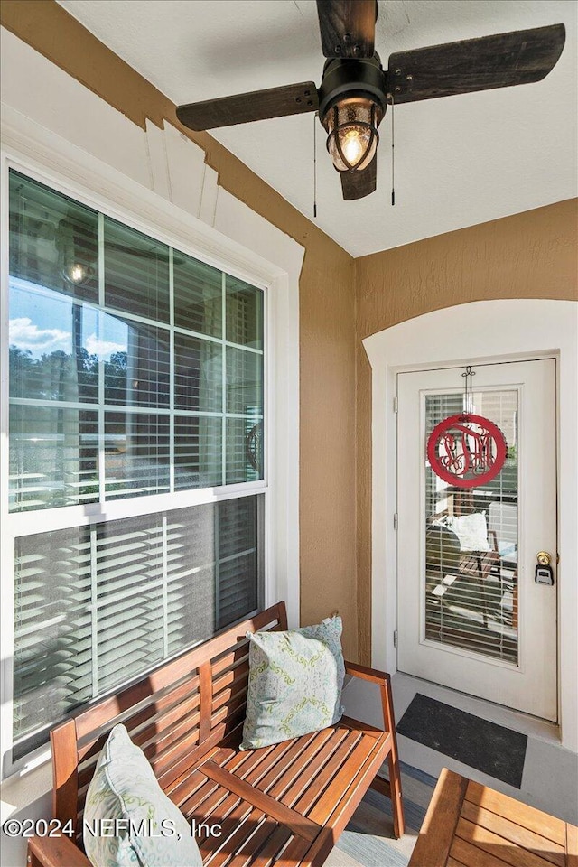 interior space featuring ceiling fan