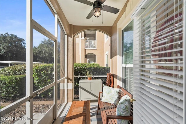 sunroom / solarium with ceiling fan