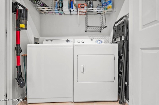 laundry room featuring washing machine and clothes dryer