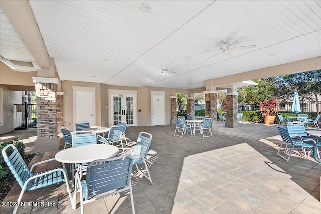 view of patio / terrace featuring ceiling fan and french doors