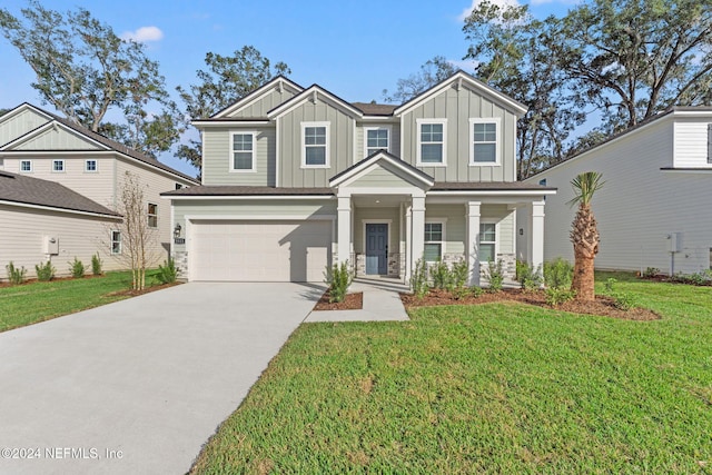 craftsman house with a front yard, a porch, and a garage