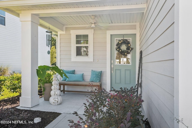 doorway to property featuring ceiling fan