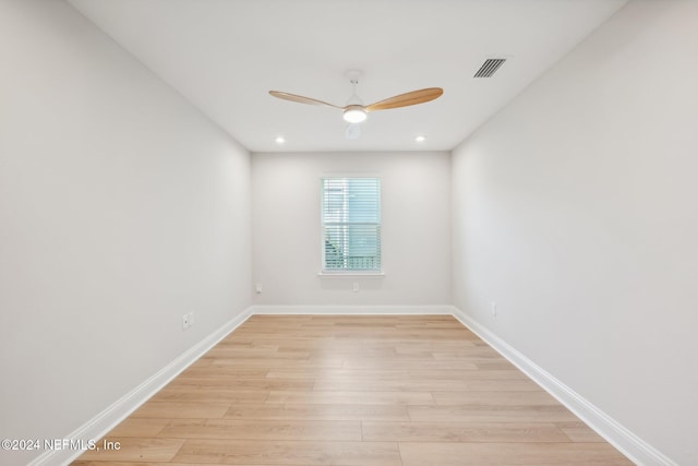 empty room featuring ceiling fan and light hardwood / wood-style floors