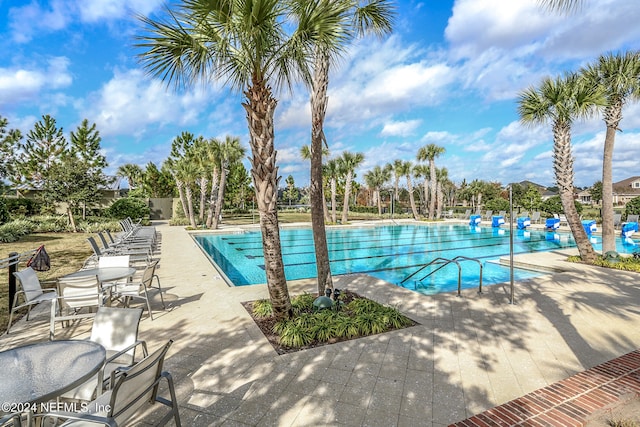 view of swimming pool with a patio