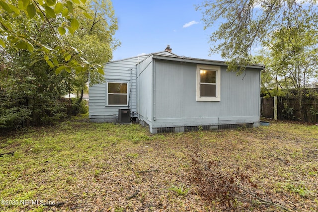 back of property featuring cooling unit