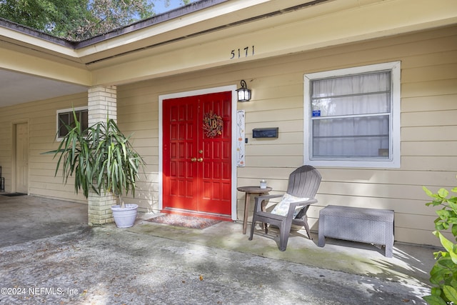 doorway to property featuring a patio area