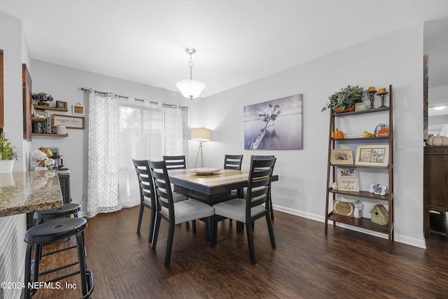 dining space featuring dark hardwood / wood-style flooring