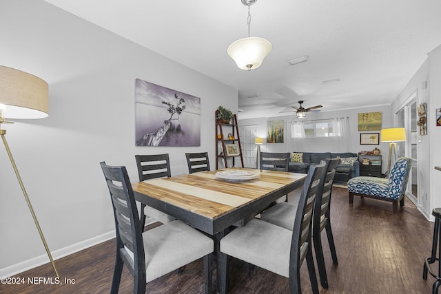 dining area featuring dark wood-type flooring and ceiling fan