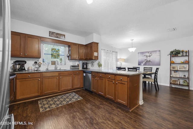 kitchen featuring sink, kitchen peninsula, decorative light fixtures, dark wood-type flooring, and dishwasher