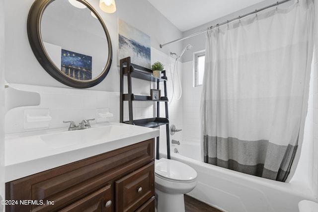 full bathroom with shower / bath combo, vanity, toilet, and decorative backsplash