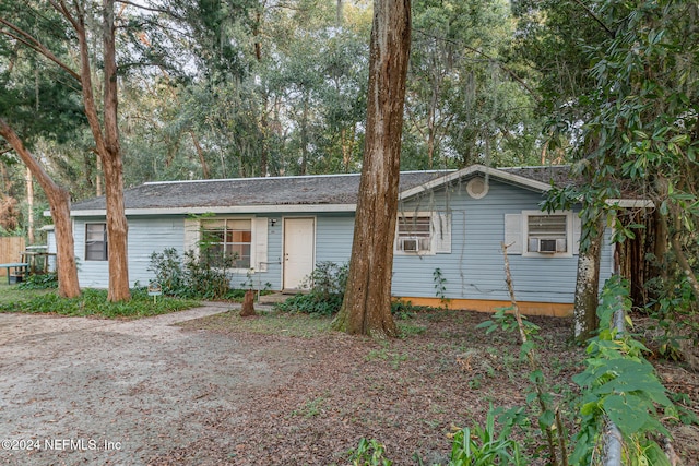 ranch-style home featuring cooling unit