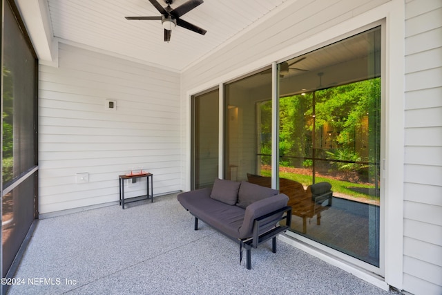 sunroom / solarium with a wealth of natural light, wooden ceiling, and ceiling fan