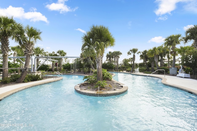 view of swimming pool with a patio