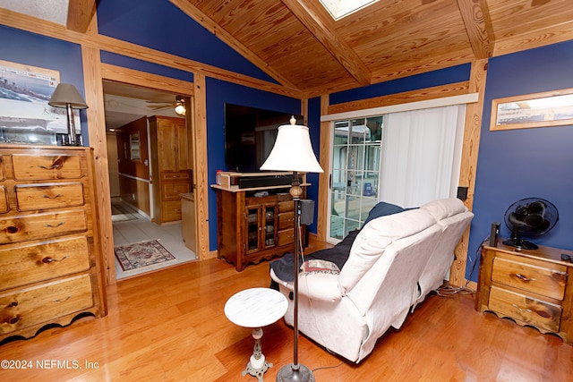 sitting room featuring ceiling fan, wood ceiling, light hardwood / wood-style flooring, and lofted ceiling with skylight