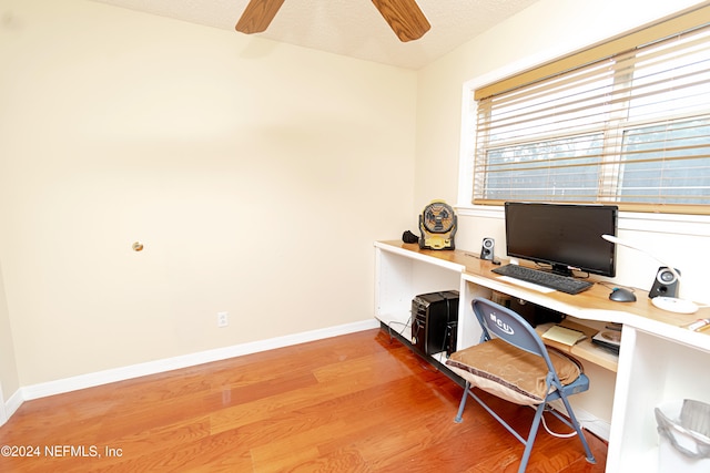 office space featuring a textured ceiling, hardwood / wood-style flooring, and ceiling fan