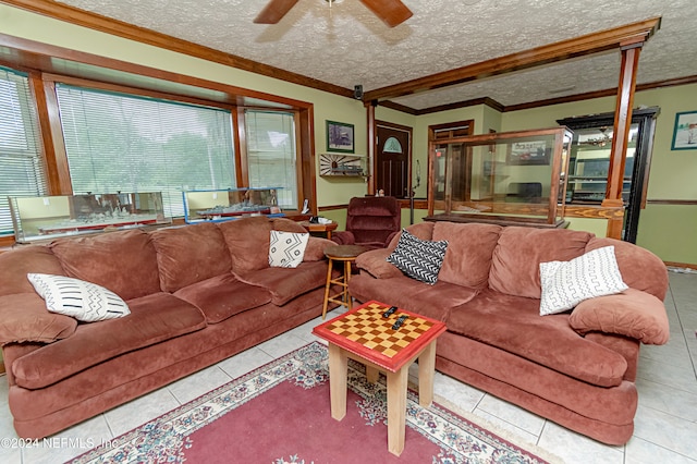 living room featuring a textured ceiling, beamed ceiling, crown molding, ceiling fan, and light tile patterned flooring