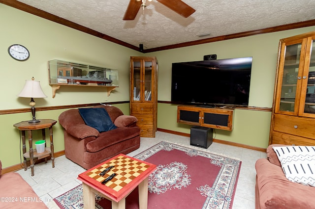 living room featuring ornamental molding, a textured ceiling, ceiling fan, and light tile patterned floors