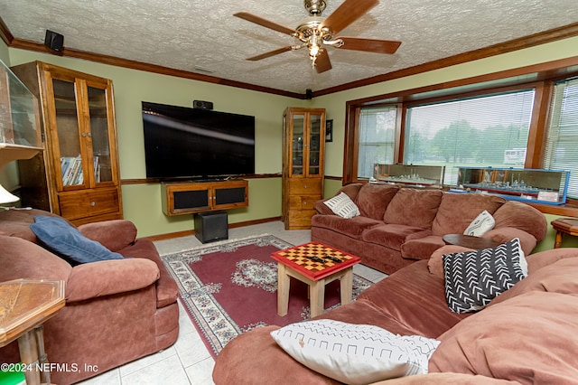 living room with ceiling fan, a textured ceiling, light tile patterned floors, and ornamental molding