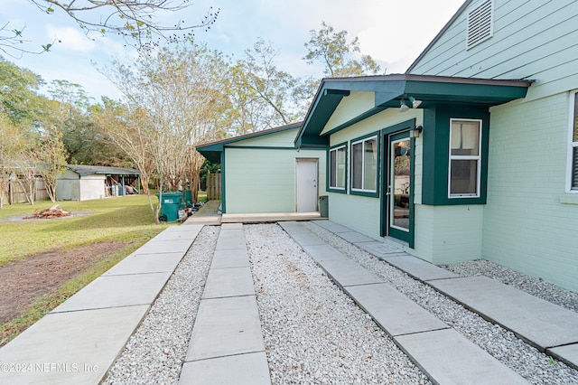 view of side of property with a yard