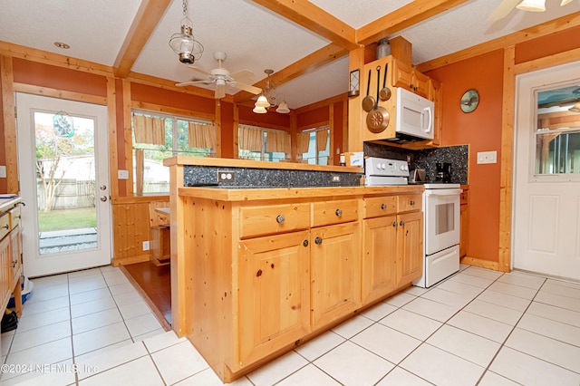 kitchen featuring light tile patterned flooring, white appliances, ceiling fan, and kitchen peninsula