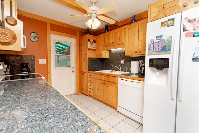 kitchen featuring tasteful backsplash, light tile patterned flooring, sink, white appliances, and ceiling fan