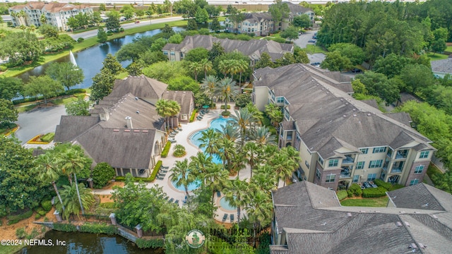 birds eye view of property featuring a water view and a residential view