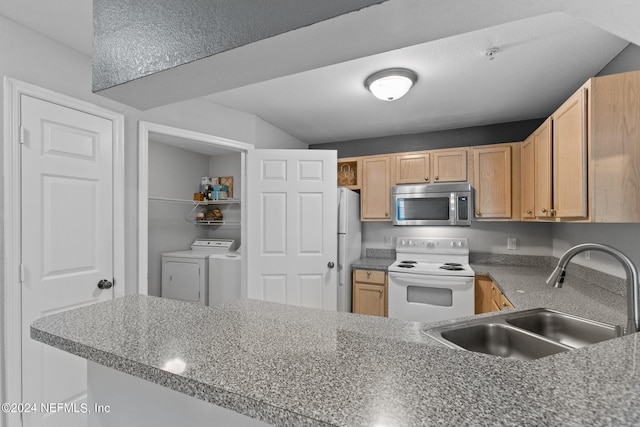 kitchen featuring washer and clothes dryer, stainless steel appliances, light brown cabinets, open shelves, and a sink