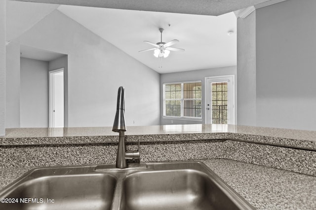 interior details with ceiling fan and a sink