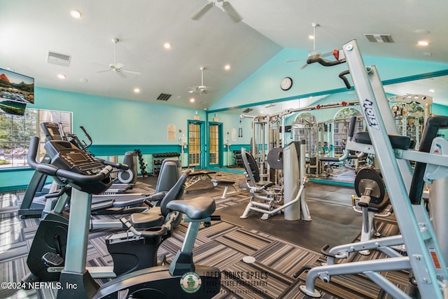 gym with high vaulted ceiling and ceiling fan