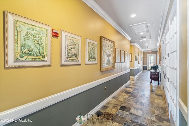 hallway with recessed lighting, baseboards, ornamental molding, stone finish floor, and attic access