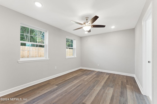 spare room featuring hardwood / wood-style floors and ceiling fan