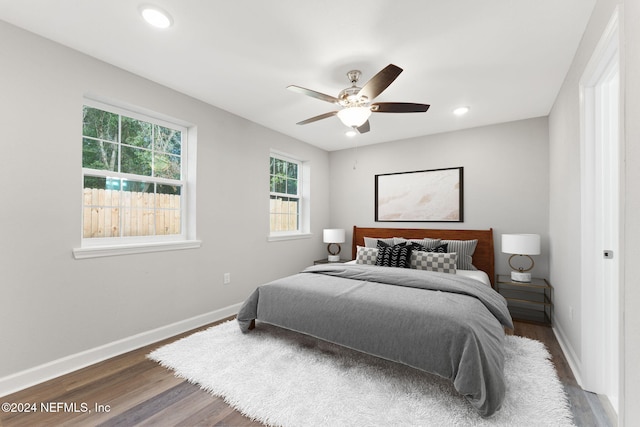 bedroom featuring ceiling fan and dark hardwood / wood-style floors