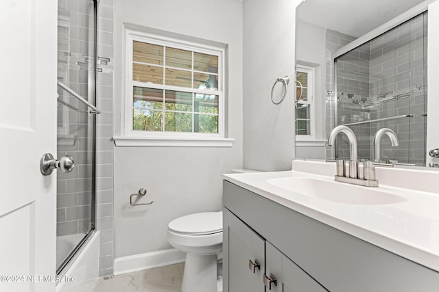 full bathroom featuring bath / shower combo with glass door, vanity, and toilet