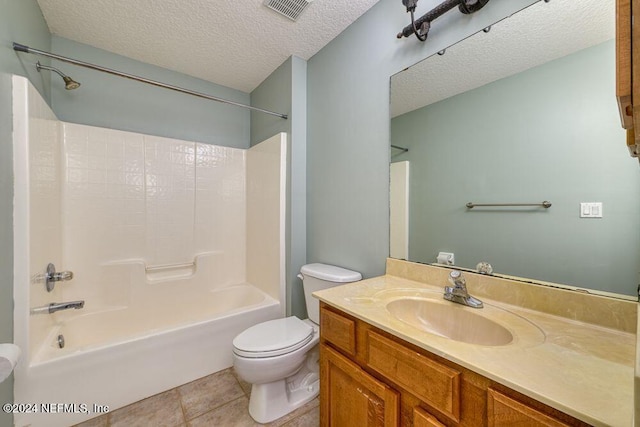 full bathroom featuring a textured ceiling, shower / bathing tub combination, tile patterned floors, vanity, and toilet