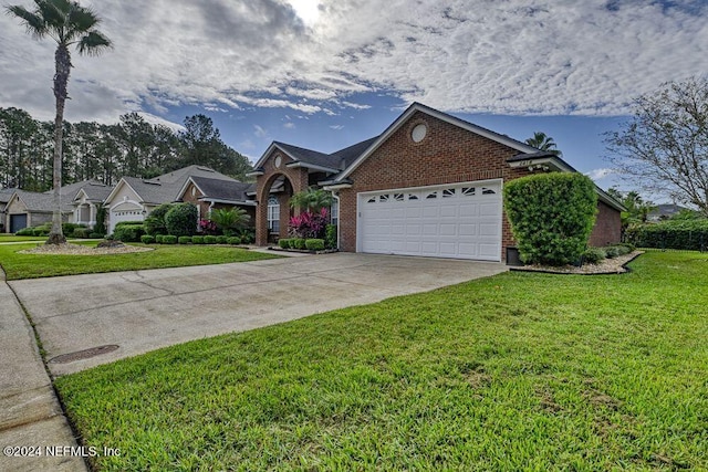 view of front facade featuring a garage and a front yard