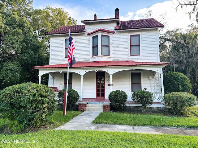 view of front of home featuring covered porch