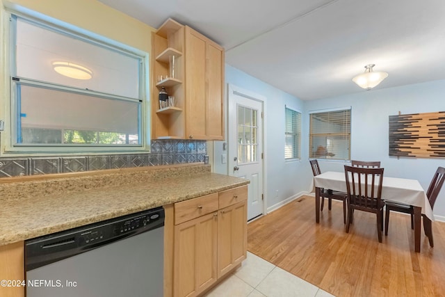 kitchen with dishwasher, decorative backsplash, light hardwood / wood-style floors, and light brown cabinets