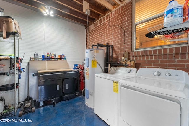 laundry room with separate washer and dryer, water heater, brick wall, and cabinets