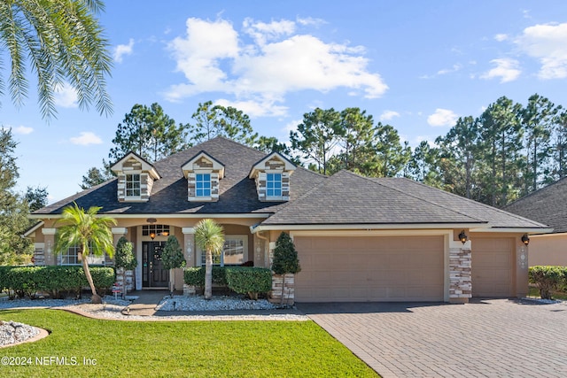 view of front facade featuring a front yard and a garage