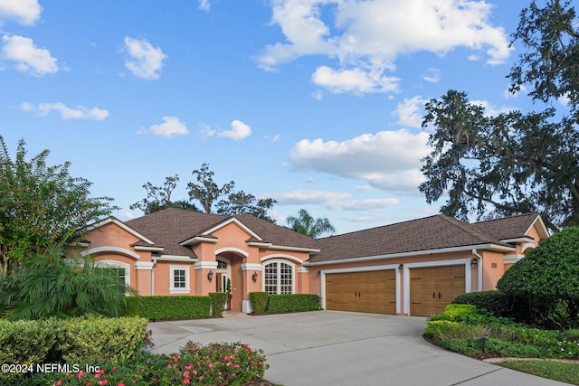 single story home with a garage