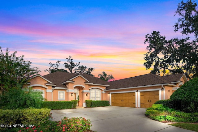 ranch-style house featuring a garage