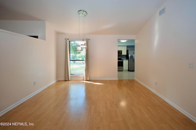 unfurnished room featuring light hardwood / wood-style floors