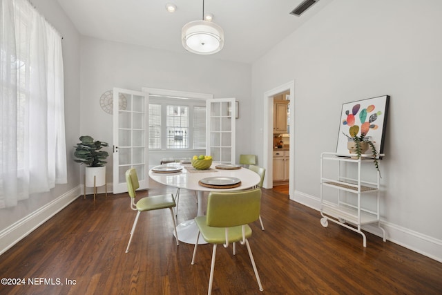 dining space featuring french doors and dark hardwood / wood-style flooring